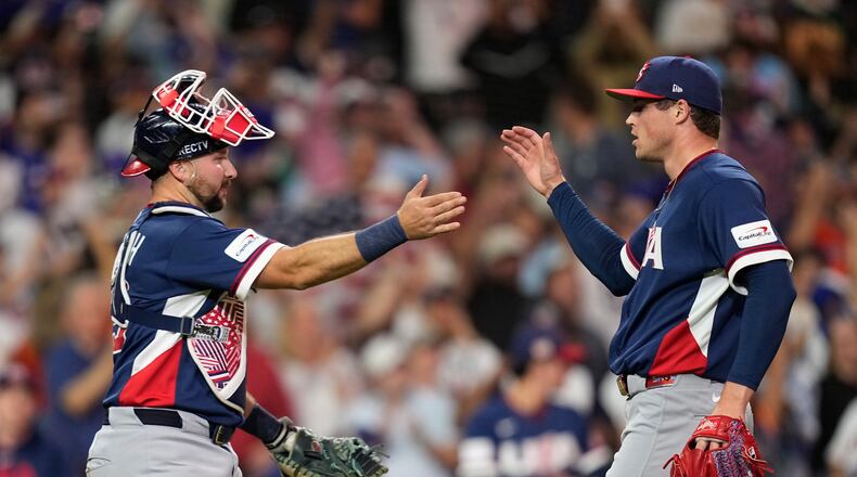 United States catcher Cal Raleigh, left, and pitcher Mason Miller, right, celebrate after their win over Canada in a World Baseball Classic quarterfinal game, Friday, March 13, 2026, in Houston. (AP Photo/David J. Phillip)