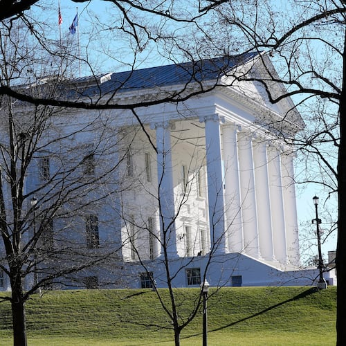 FILE - The state and U.S. flags fly over the Virginia State Capitol as the 2024 session of the Virginia General Assembly gets underway, Jan. 10, 2024, in Richmond, Va. (AP Photo/Steve Helber, File)