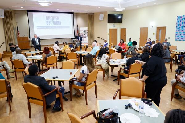 State Rep. Angela Moore, D-Stonecrest, asks questions to Insurance Commissioner John King during a town hall meeting on tort reform at the Lou Walker Senior Center in  Stonecrest on Wednesday, April 16, 2025.
(Miguel Martinez/AJC)