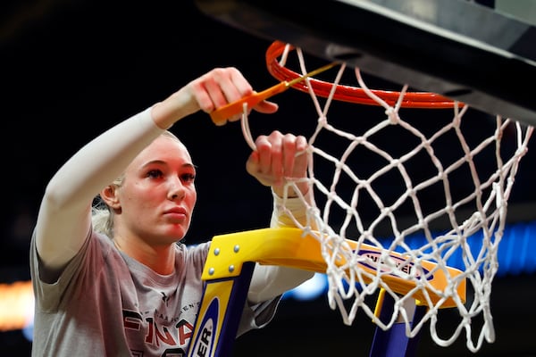 South Carolina forward Chloe Kitts cuts down the net after they defeated Duke to advance to the Final Four in the Elite Eight of the NCAA college basketball tournament, Sunday, March 30, 2025, in Birmingham, Ala. (AP Photo/Butch Dill)