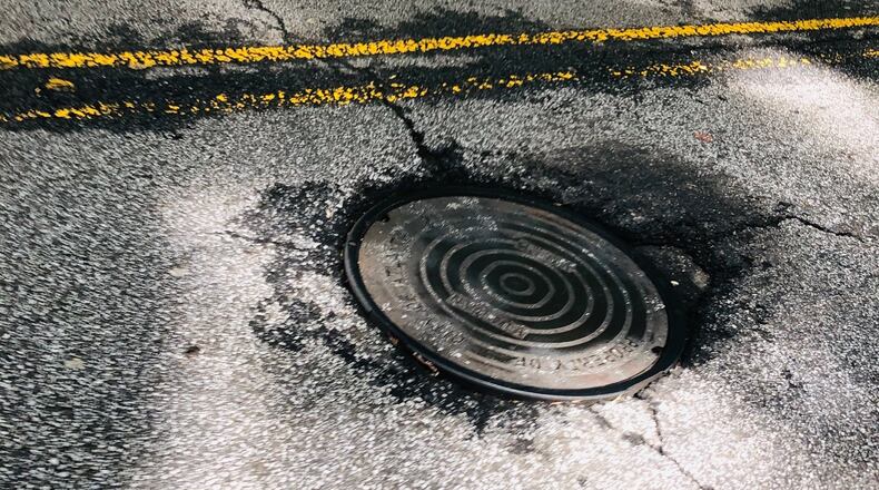 Clay Edwards has been waiting a long time to have this manhole fixed.