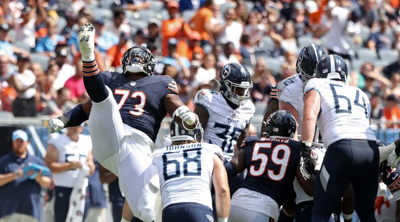 Chicago Bears defensive tackle Travis Bell (73) celebrates after sacking Tennessee Titans quarterback Malik Willis (7) at Soldier Field on Saturday, Aug. 12, 2023, in Chicago. (John J. Kim/Chicago Tribune/TNS)