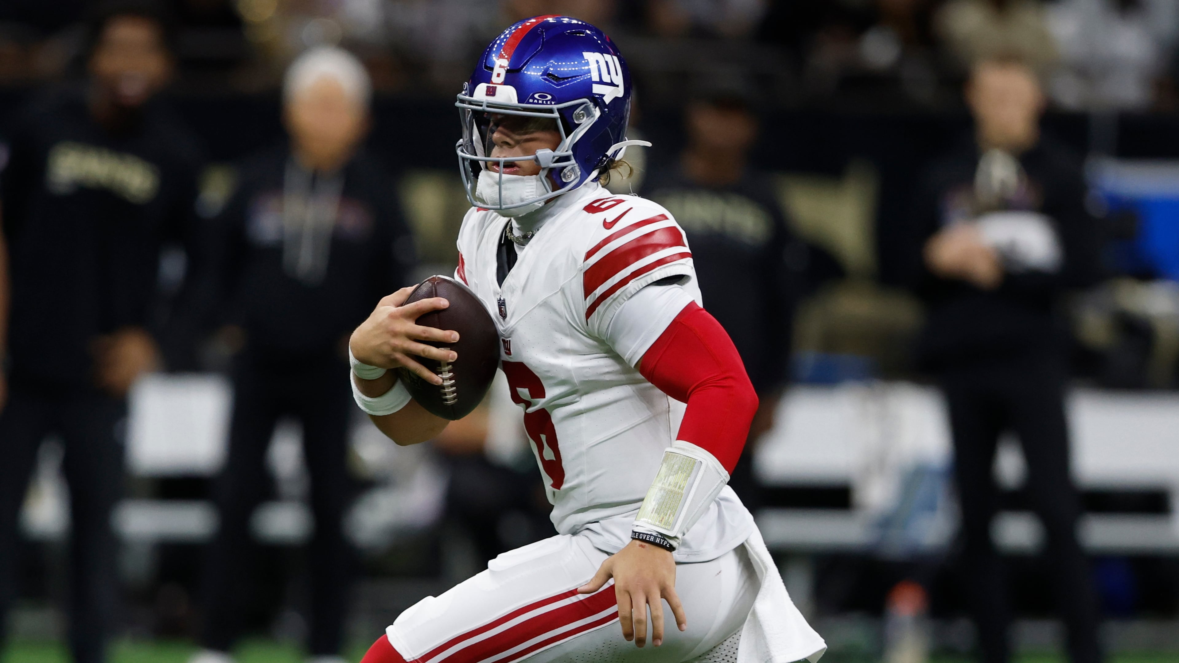 New York Giants quarterback Jaxson Dart (6) runs out of the pocket against the New Orleans Saints in the first half of an NFL football game, Sunday, Oct. 5, 2025, in New Orleans. (AP Photo/Butch Dill)