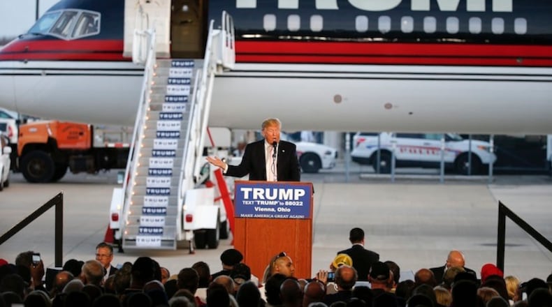 Republican presidential candidate, Donald Trump holds a plane-side rally in a hanger at Youngstown-Warren Regional Airport in Vienna, Ohio. Pick a president: New York multimillionaire or New York multibillionaire. The likely November rivalsí, Trump and Hillary Clinton, personal portfolios donít exactly square with the populist wave defining 2016. (AP Photo/Gene J. Puskar, File)
