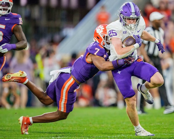 Clemson safety Khalil Barnes (left) tackles Furman running back Ben Croasdale on Saturday, Nov. 22, 2025, in Clemson, S.C. (Jacob Kupferman/AP)