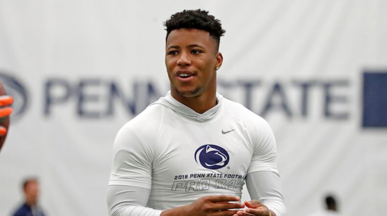 Penn State running back Saquon Barkley, tosses a football during Penn State Pro Day in State College, Pa., Tuesday, March 20, 2018. Barkley did not participate in the drills. (AP Photo/Gene J. Puskar)