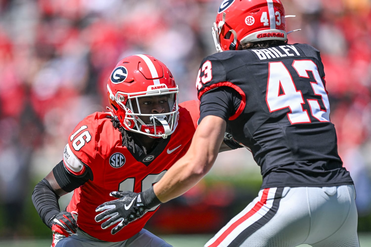 Georgia Red Team’s Maurice Hayes (16) goes up against against Black Team’s Marek Briley (43) during the second half of the G-Day spring football game Saturday, April 12, 2025 at Sanford Stadium in Athens. (Daniel Varnado/For the Atlanta Journal-Constitution)