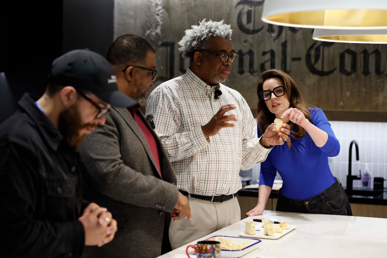 AJC Senior Food & Dining Editor Monti Carlo, right, helps Race and Culture Reporter Ernie Suggs analyze the flavors of a biscuit, while AJC Editor-in-Chief Leroy Chapman Jr. and Director of Social Media Travis Lyles enjoy them during a tasting contest to find the best biscuit in Atlanta on Tuesday, April 28, 2026. (Miguel Martinez/AJC)