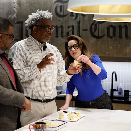 AJC Senior Food & Dining Editor Monti Carlo, right, helps Race and Culture Reporter Ernie Suggs analyze the flavors of a biscuit, while AJC Editor-in-Chief Leroy Chapman Jr. and Director of Social Media Travis Lyles enjoy them during a tasting contest to find the best biscuit in Atlanta on Tuesday, April 28, 2026. (Miguel Martinez/AJC)