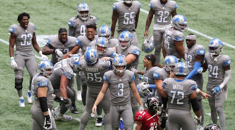The Detroit Lions celebrate 23-22 comeback win over the Atlanta Falcons Sunday, Oct. 25, 2020, at Mercedes-Benz Stadium in Atlanta. (Curtis Compton / Curtis.Compton@ajc.com)