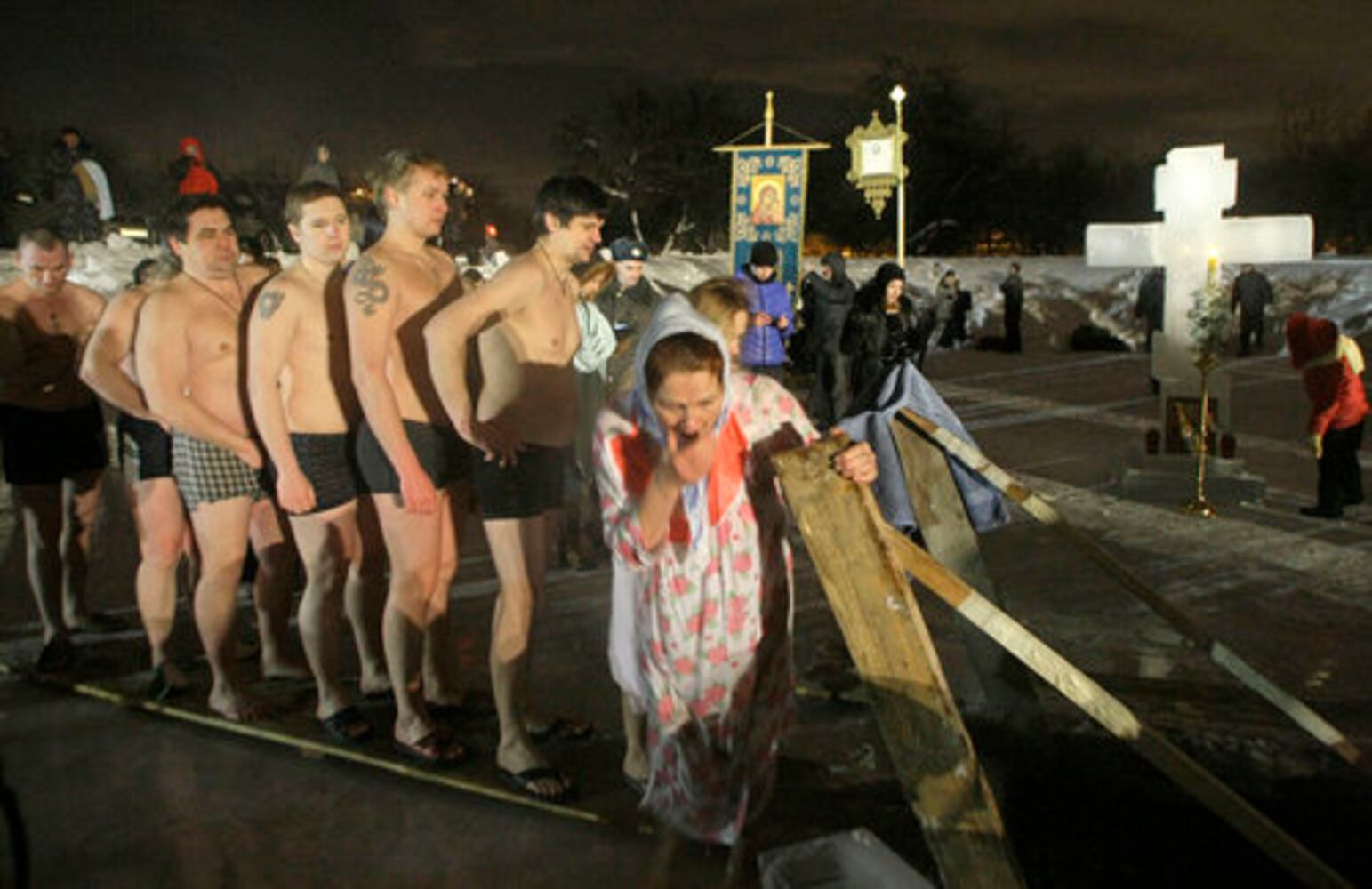 Think it's cold? Russians plunge into ice bath