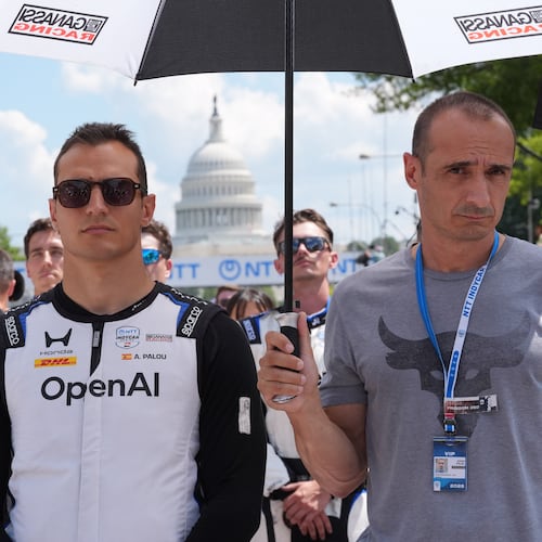 Alex Palou (10) of Spain stands during the National Anthem before the IndyCar Freedom 250 Grand Prix auto race in Washington, Sunday, Aug. 23, 2026. (AP Photo/Alex Brandon)