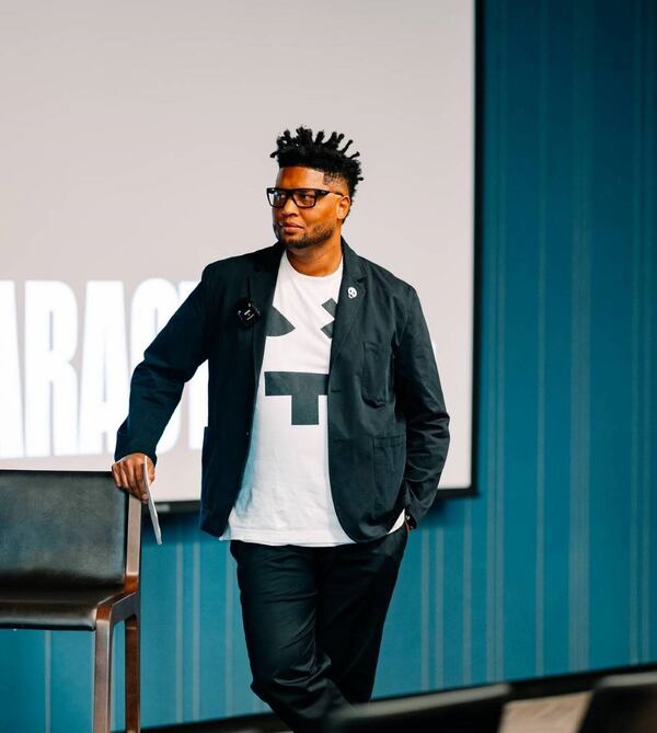 Tantrum Agency founder-CEO David Tann moderates a panel for "Characters: Type in Action," an exhibition on typography as a form of social justice, on Thursday, Sept. 19, 2024 at Museum of Design Atlanta.