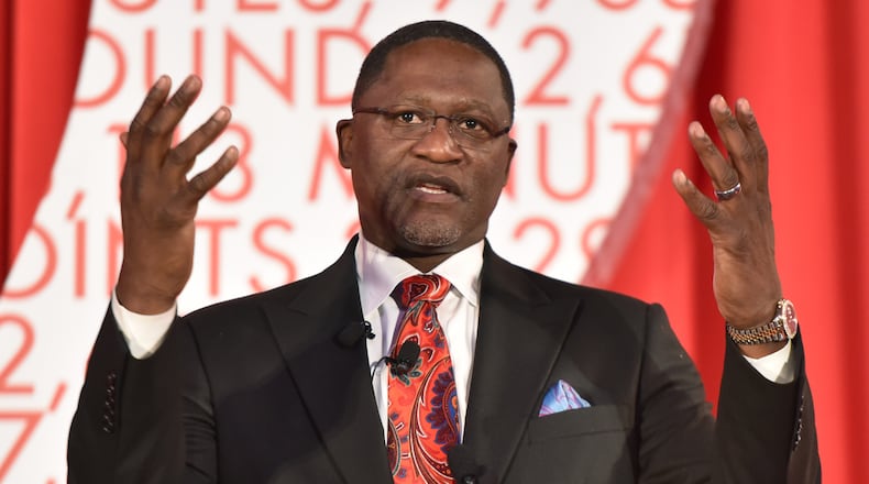 Dominique Wilkins speaks after his statue was unveiled at Philips Arena on Thursday, March 5, 2015. (AJC file photo)