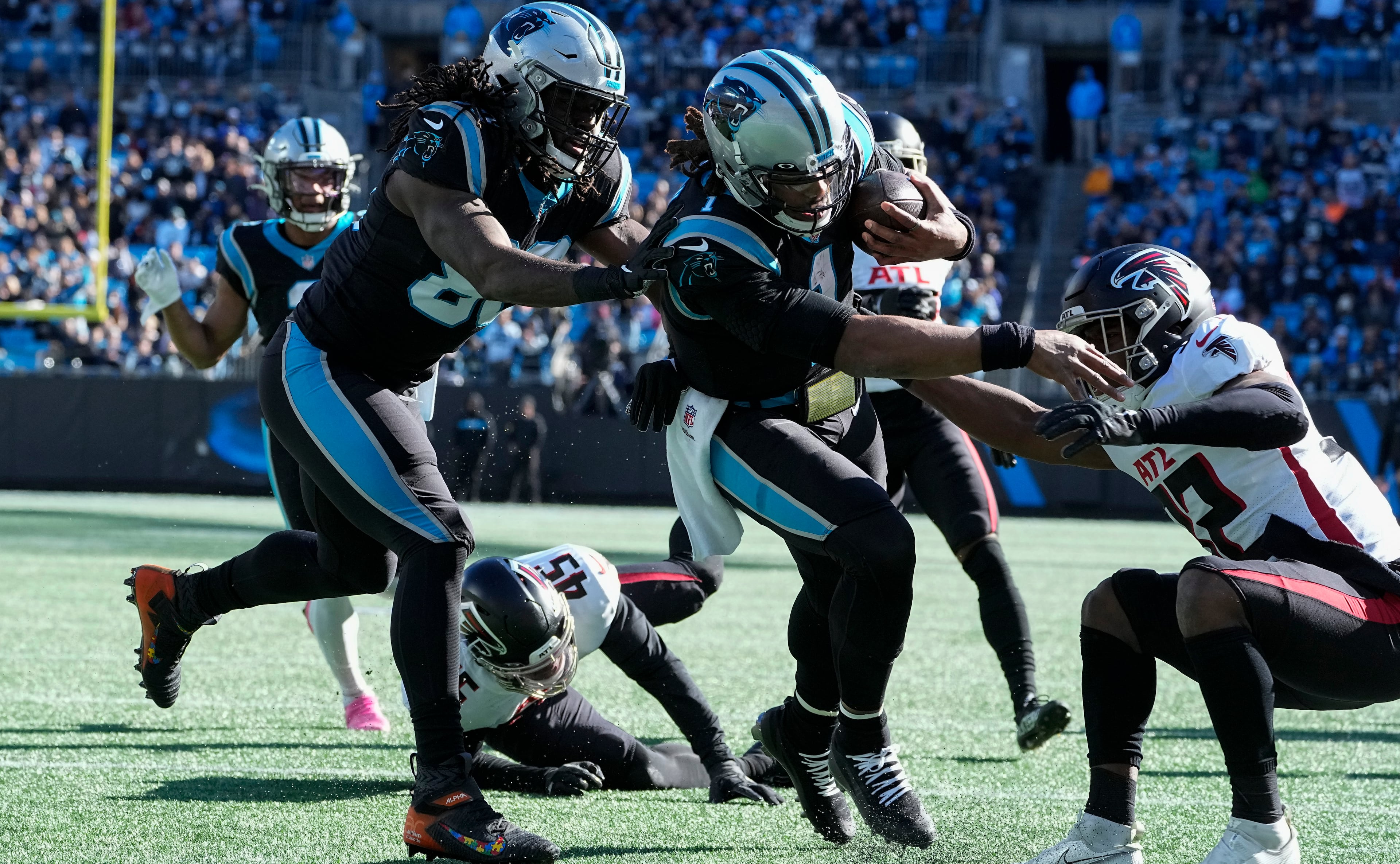 Cam Newton, then quarterback of the Carolina Panthers, runs for a touchdown during the first quarter of a Dec. 12, 2021, game against the Falcons in Charlotte. (John Bazemore/AP)