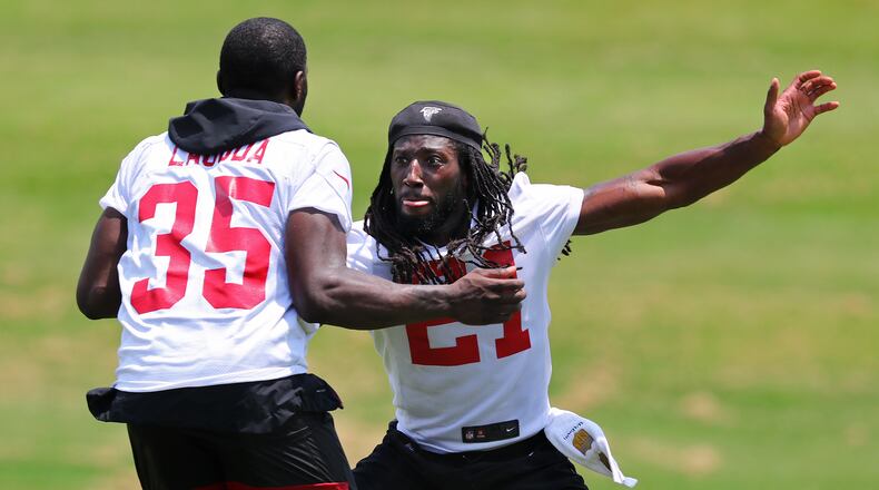 Falcons cornerback Desmond Trufant (right) works with safety Afolabi Laguda.  Curtis Compton/ccompton@ajc.com