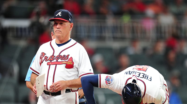 ATLANTA, GA - MAY 17: Freddie Freeman #5 of the Atlanta Braves is removed by Manager Brian Snitker #43 after being hit by a fifth inning pitch against the Toronto Blue Jays at SunTrust Park on May 17, 2017 in Atlanta, Georgia. (Photo by Scott Cunningham/Getty Images)