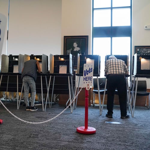 People vote in the Democratic primaries at Blair-Caldwell Library, Tuesday, June 30, 2026, in Denver. (AP Photo/Rebecca Slezak)