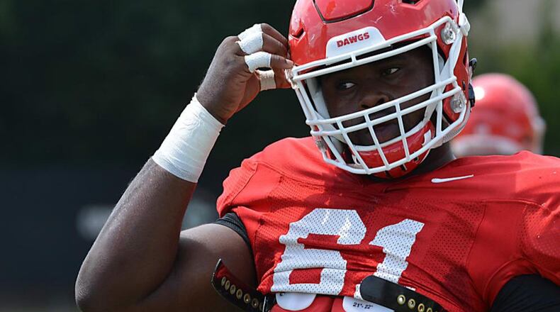 Georgia offensive lineman Chris Barnes (61) was wearing the No. 97 on Tuesday and was working with the defensive line.