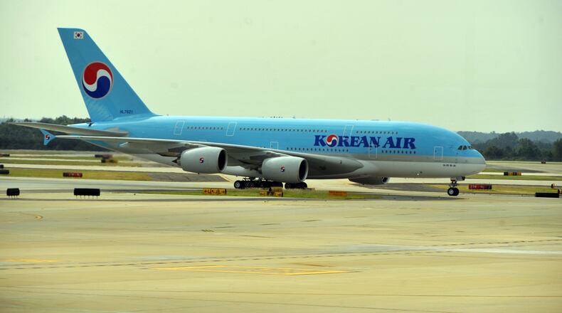 The plane arrives from Seoul Friday morning. Hartsfield-Jackson International Airport and City of Atlanta dignitaries as well as Korean Air officials celebrated the arrival of Korean Air's Airbus A380, the world's largest passenger aircraft, with a ribbon-cutting ceremony and a water cannon salute Friday, September 6, 2013. Following the ceremony, guests were invited to an in-flight tour of airbus A380. Airbus A380 highlights include an exclusive upstairs prestige class, a duty-free showcase and three bars. The plane has seating for 407 passengers. Korean Air will operate the Airbus A380 between Atlanta and Asia on Wednesdays, Fridays and Sundays. The airline will start daily A380 service to Asia in October. KENT D. JOHNSON / KDJOHNSON@AJC.COM