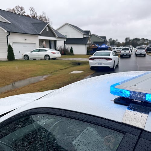 Law enforcement vehicles block the road to Wellington Delano Dickens III's home, where remains were found after Dickens told authorities he had killed four of his children, in Zebulon, N.C., on Tuesday, Oct. 28, 2025. (AP Photo/Allen G. Breed)