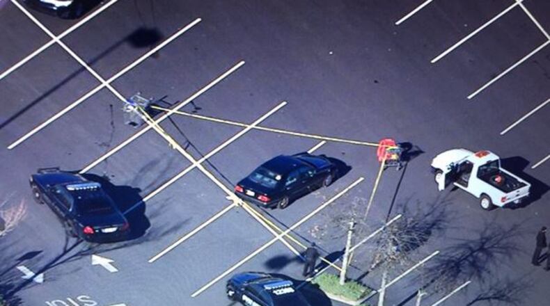 A body was found Thurs., Jan. 14, 2016, in a car in a Kroger parking lot at Wesley Chapel and South Hairston roads. (Credit: Channel 2 Action News)