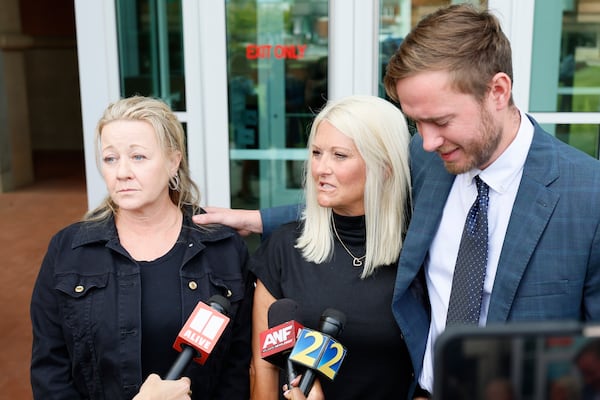 Leslie Woods (from left), Kellie Lindsey and Dillon Wall speak to the media after the sentencing hearing of former state trooper Anthony Scott on Wednesday, Oct. 1, 2025. “It will never be enough. But we are definitely pleased,” Lindsey said. (Miguel Martinez/AJC)