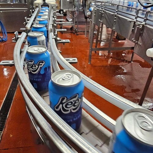 Cans of seltzer containing THC, the active ingredient in marijuana, speed down the canning line at Indeed Brewing in Minneapolis on Thursday, Nov. 20, 2025. (AP Photo/Steve Karnowski)