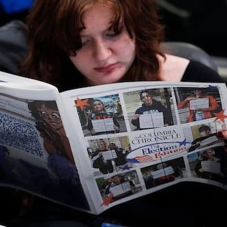 FILE - Columbia College Chicago student Kailey Ryan reads a newspaper in Chicago on Nov. 5, 2024. (AP Photo/Nam Y. Huh, File)