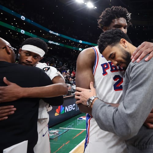 Boston Celtics' Jayson Tatum (right) and Philadelphia 76ers' Joel Embiid (left) embrace following Philadelphia's victory in Game 7 in a first-round NBA basketball playoffs series, Saturday, May 2, 2026 in Boston. (AP Photo/Jim Davis)