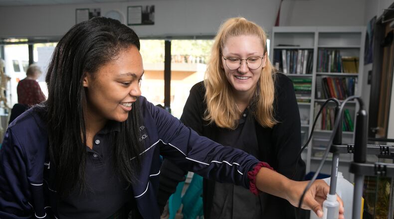 Maxena Greissland (L) and Mia Durroh team up in an AP Environmental Science class at the Atlanta Girls' School, which marks its 20th anniversary this year.