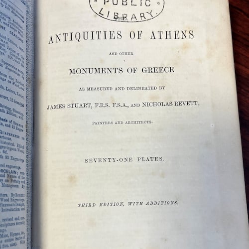 In this photo provided by Catherine Taylor a page of the book "Antiquities of Athens," stamped by a library, is shown on Thursday, July 30, 2026, after its return in Kiama, Australia, an estimated 150 years late. (Catherine Taylor via AP)