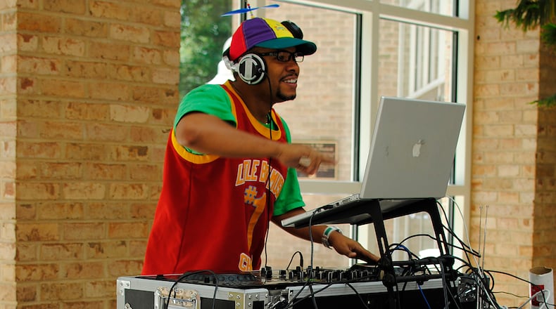 DJ Willy Wow spins dance tunes at Fernbank Museum of Natural History. Contributed by Fernbank Museum of Natural History