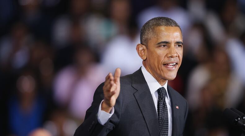 CHICAGO, IL - FEBRUARY 19: President Barack Obama speaks to guests at the Gwendolyn Brooks College Preparatory Academy on February 19, 2015 in Chicago, Illinois. Obama used the event to designate Chicago's historic Pullman district a national monument. Dating back to the 1880s, the Pullman district, on the city's Far South Side, is one of the country's first company towns. The 'town' was founded by George Pullman to house workers at his now-defunct Pullman Palace Car Co., which made luxurious rail cars. (Photo by Scott Olson/Getty Images)