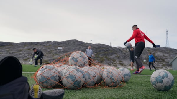 Soccer balls lie on a pitch of Nuuk stadium in Nuuk, Greenland, Tuesday, June 17, 2025. (AP Photo/Kwiyeon Ha)
