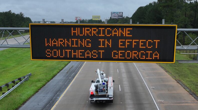 Hurricane warning sign is displayed on I-75 near Adel, Thursday, September 26, 2024. Hurricane Helene is set to make landfall as a major storm in Florida on Thursday evening, bringing rain and damaging wind to Georgia. Emergency officials are warning of fallen trees, downed power lines, shuttered roads and even the possibility of landslides as Helene makes its way through Georgia overnight. (Hyosub Shin / AJC)
