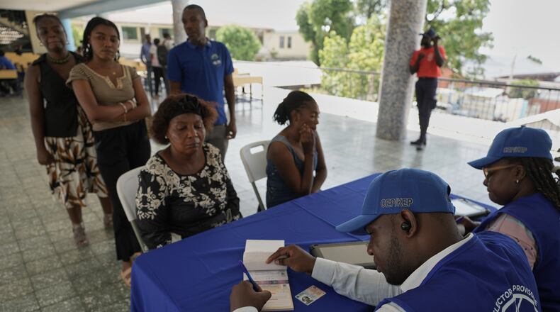 Haitians register to vote in the upcoming general election in Port-au-Prince, Haiti, Thursday, July 30, 2026. (AP Photo/Odelyn Joseph)