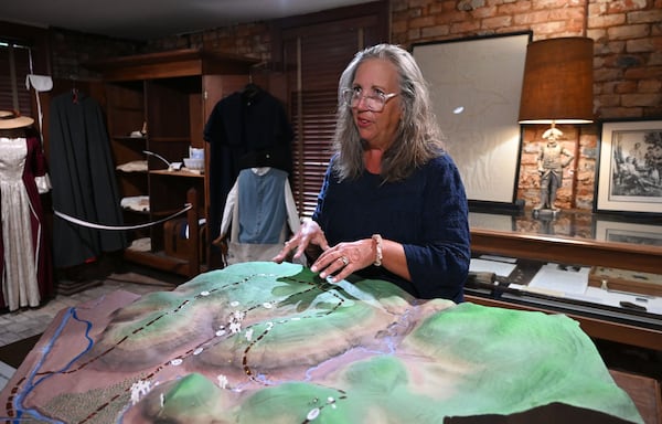 Stephanie Macchia, director at the Washington Historical Museum, shows a 3D map of Kettle Creek Battlefield. The exact location of the battle is under debate. (Hyosub Shin/AJC)