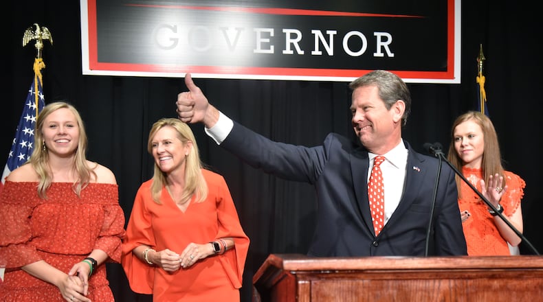 Gov. Brian Kemp often mentions his three daughters when discussing education policy. Here, he's shown on election night in 2018 in Athens with (background from left) daughter Jarrett, wife Marty and daughter Amy Porter. (Hyosub Shin / Hyosub.Shin@ajc.com)