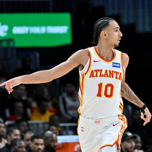 Atlanta Hawks forward Zaccharie Risacher (10) reacts after scoring during the first half in a preseason NBA basketball game at State Farm Arena, Thursday, October 16, 2025, in Atlanta. Houston Rockets won 133-115 over Atlanta Hawks. (Hyosub Shin / AJC)