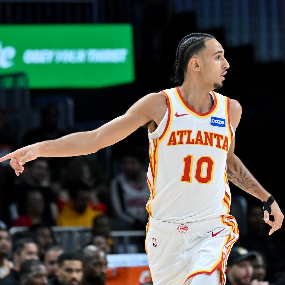 Atlanta Hawks forward Zaccharie Risacher reacts after scoring during the first half in a preseason NBA basketball game at State Farm Arena, Thursday, October 16, 2025, in Atlanta. (Hyosub Shin/AJC)