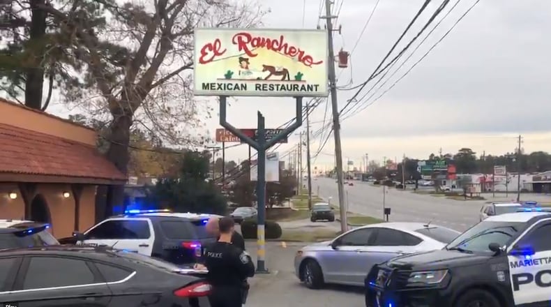 Marietta police investigated a shooting Sunday afternoon at the El Ranchero restaurant on Cobb Parkway. The suspect in the shooting fled, prompting a massive manhunt, according to police.