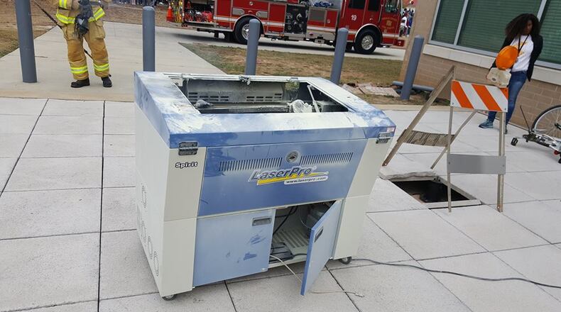 Police say a laser engraving machine caused a fire call to a DeKalb County high school on Friday afternoon. (Credit: Chamblee Police Department)