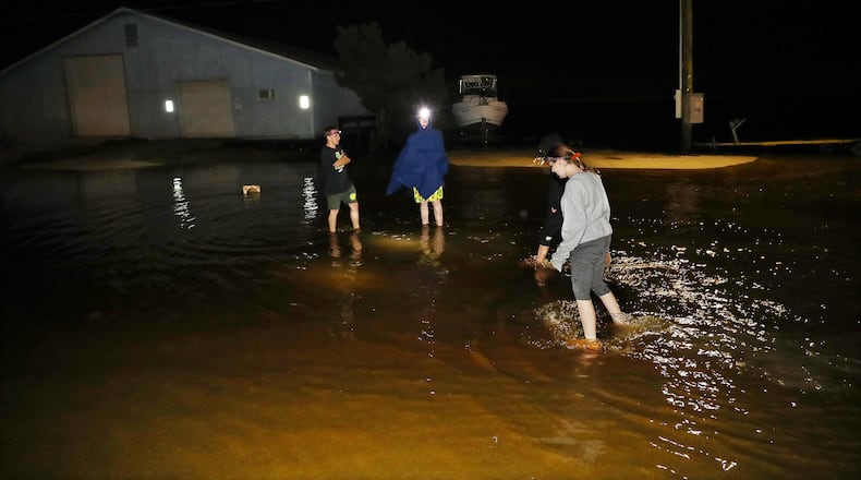 093022 St. Mary’s: Local residents check minor flooding at Lang's Marina from Hurricane Ian on St, Mary’s Street in historic downtown St. Mary’s while the storm passes by heading toward South Carolina in the early hours of Friday, Sept. 30, 2022,   “Curtis Compton / Curtis Compton@ajc.com