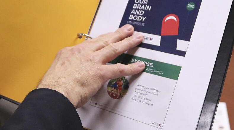 Jan. 23, 2017 - Norwin School Distict Superintendent of Schools, William H. Kerr shows materials being considered in use in the development of a curriculum for educating students in the district about opioid drug addiction. (AP Photo/Keith Srakocic)