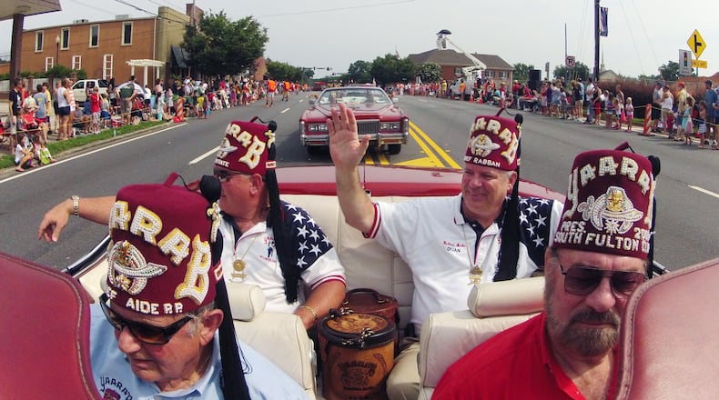 Ten years ago, Richard Burke (waving) knew nothing about Shriners except they wore funny hats and rode in parades. But when a tragic accident befell his family, the organization rallied around them in ways Burke could have never imagined.