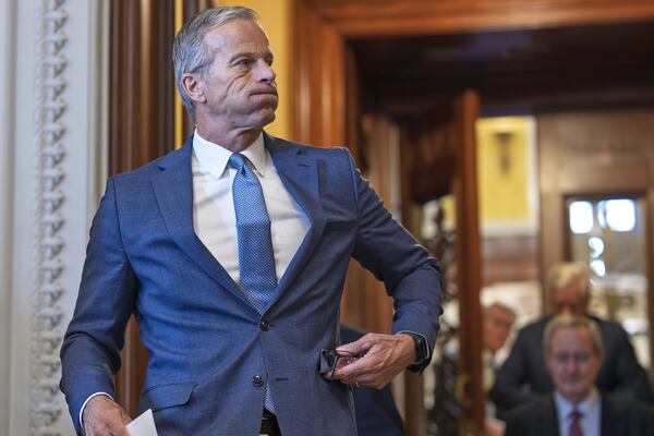 Senate Majority Leader John Thune, R-S.D., emerges from the chamber just after passage of the budget reconciliation package of President Donald Trump's signature bill of big tax breaks and spending cuts, at the Capitol in Washington, Tuesday, July 1, 2025. (AP Photo/J. Scott Applewhite)