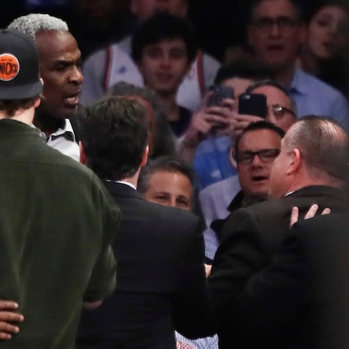 FILE - Former New York Knicks player Charles Oakley, rear left, exchanges words with a security guard during the first half of an NBA basketball game between the Knicks and the Los Angeles Clippers in New York on Feb. 8, 2017. (AP Photo/Frank Franklin II, File)
