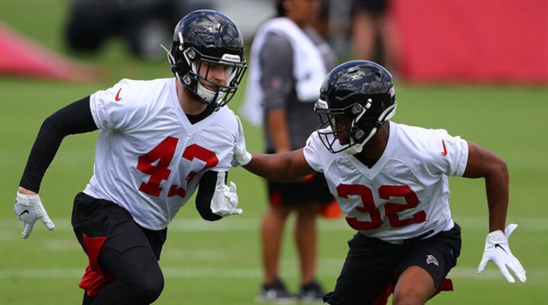 Falcons safety Parker Baldwin (left) works against cornerback Rashard Causey (right) during rookie minicamp on Friday, May 10, 2019, in Flowery Branch. Curtis Compton/ccompton@ajc.com