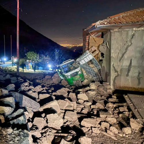 A motor tricycle is stuck amid the debris of homes that collapsed after an earthquake struck Pumpuya, Peru, Sunday, July 19, 2026. ( AP Photo/Jhefry Sedano)